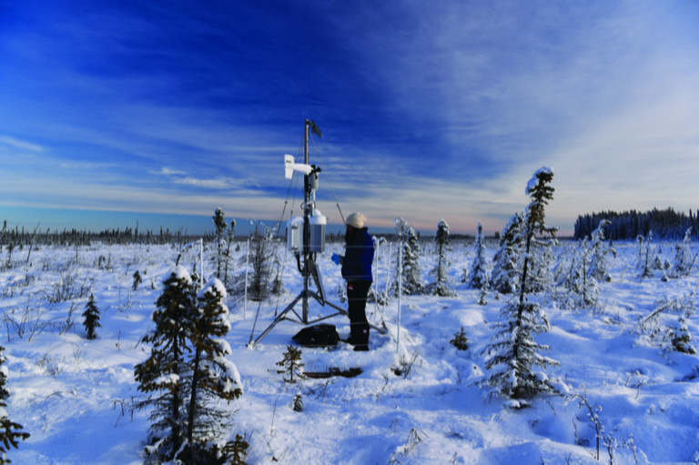 Checking a monitoring station in winter
